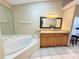 Primary bath boasts a soaking tub, double vanity with granite counters at 459 Wood Rose Ln, Altamonte Springs, FL 32714