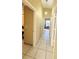 Hallway with tile flooring leading to multiple rooms at 459 Wood Rose Ln, Altamonte Springs, FL 32714