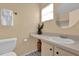 Bathroom with a clean vanity, toilet, and decorative vase at 4804 Laddie Ct, Orlando, FL 32821