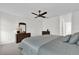 Comfortable main bedroom with ceiling fan, dresser, and mirror at 4804 Laddie Ct, Orlando, FL 32821