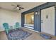 Charming front porch with seating area and colorful rug at 4804 Laddie Ct, Orlando, FL 32821