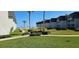 Beautifully landscaped grounds with lush green grass and views of the condo buildings in the distance at 4831 Saxon Dr # 1130, New Smyrna Beach, FL 32169