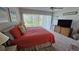 Bright main bedroom with tiled floors and TV at 4831 Saxon Dr # 1130, New Smyrna Beach, FL 32169