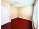 Cozy bedroom with hardwood floors, ample natural light, and a neutral color scheme at 5 W Harding St # E, Orlando, FL 32806