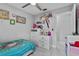 bedroom with playful wall decorations, storage, and ample closet space at 5149 Clarion Oaks Dr, Orlando, FL 32808