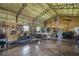 Barn interior with high ceilings, equipment, and workspace at 5335 Canoe Creek Rd, St Cloud, FL 34772