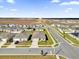 Overhead view of a residential neighborhood with consistent home designs and developing landscape at 545 Jerry Ln, Haines City, FL 33844