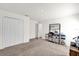 Bedroom with carpeted flooring, closet, and entry to hallway and/or bath at 545 Jerry Ln, Haines City, FL 33844