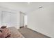 Bright bedroom features white walls, carpeted floor, closet and entry to bathroom at 545 Jerry Ln, Haines City, FL 33844