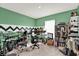 Eclectic bedroom featuring a large window, musical instruments, and vibrant colors at 545 Jerry Ln, Haines City, FL 33844