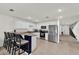 Modern kitchen with stainless steel appliances, granite countertops, and bar seating at 545 Jerry Ln, Haines City, FL 33844