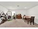 Bright living room with plants, piano, swing chair and dining table at 545 Jerry Ln, Haines City, FL 33844