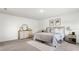 A serene main bedroom with soft carpet, neutral decor, and a comfortable bed at 545 Jerry Ln, Haines City, FL 33844
