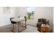 A bright home office with a stylish desk, a comfortable chair, and a view of the neighborhood at 545 Jerry Ln, Haines City, FL 33844