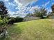 Well maintained backyard with a wood fence and mature landscaping at 546 Nogales Ct, Kissimmee, FL 34758