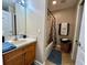 Standard bathroom with tub and shower combination, vanity, and ceramic tile flooring at 546 Nogales Ct, Kissimmee, FL 34758