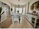 Cozy dining room with stylish furniture, decor, and ample natural light from the bay window at 546 Nogales Ct, Kissimmee, FL 34758