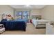 Shared bedroom featuring two beds, bright windows, and plush carpeting at 7217 Dr Phillips Blvd, Orlando, FL 32819