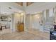 Inviting foyer with neutral paint colors, hard surface flooring, and a staircase at 7217 Dr Phillips Blvd, Orlando, FL 32819