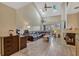 Spacious living room featuring vaulted ceilings, a fireplace, and ample natural light at 7217 Dr Phillips Blvd, Orlando, FL 32819