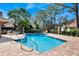 Community pool area with lounge chairs and well-maintained brick pavers at 7217 Dr Phillips Blvd, Orlando, FL 32819