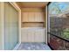 Screened-in porch featuring cabinetry and view of the backyard at 7217 Dr Phillips Blvd, Orlando, FL 32819