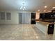 Open concept view of kitchen/dining with tiled flooring and modern lighting at 7606 Loon Ave, Winter Garden, FL 34787