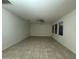 Spacious living room with tile floors and natural lighting at 7606 Loon Ave, Winter Garden, FL 34787