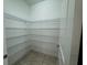 Walk-in pantry with plenty of adjustable shelving at 7606 Loon Ave, Winter Garden, FL 34787