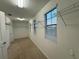 Bright walk-in closet includes wire shelving, tan carpeting, and natural light from multiple windows at 7606 Loon Ave, Winter Garden, FL 34787