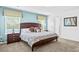 Inviting bedroom featuring a plush bed, nightstands, and ample natural light at 9114 Stromboli Ct, Kissimmee, FL 34747