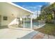 The backyard features a covered patio, a pool, and a fenced-in yard at 10526 Fernando St, Orlando, FL 32825