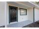 Inviting front entryway featuring decorative tile work and a secure, stylish door at 10526 Fernando St, Orlando, FL 32825