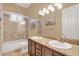 Bathroom features dual sinks, granite countertops, and a shower-tub combination at 10742 Boca Pointe Dr, Orlando, FL 32836