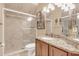 Bathroom with tiled shower, granite countertops, and tile flooring at 10742 Boca Pointe Dr, Orlando, FL 32836