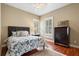 Bedroom offers a large bed and ample natural light at 10742 Boca Pointe Dr, Orlando, FL 32836
