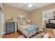 Cozy bedroom with hardwood floors, neutral colors, and natural light at 10742 Boca Pointe Dr, Orlando, FL 32836