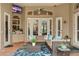 Relaxing outdoor covered patio area with comfortable furniture and a ceiling fan at 10742 Boca Pointe Dr, Orlando, FL 32836