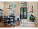Dining room with hardwood floors, plantation shutters and a modern chandelier at 10742 Boca Pointe Dr, Orlando, FL 32836