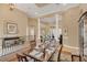 Open-concept dining room featuring columns and views into the living room creating an inviting atmosphere at 10742 Boca Pointe Dr, Orlando, FL 32836