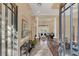 Inviting foyer with tile flooring, columns, and iron banister showcasing the home's open floor plan at 10742 Boca Pointe Dr, Orlando, FL 32836