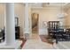 Open-concept hallway with decorative columns leading to the dining room and staircase at 10742 Boca Pointe Dr, Orlando, FL 32836