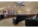A cozy home theater with comfortable leather seating and a large screen, perfect for movie nights at 10742 Boca Pointe Dr, Orlando, FL 32836
