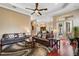 Large living room with hardwood floors, two sofas, and an open floorplan at 10742 Boca Pointe Dr, Orlando, FL 32836
