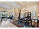 Elegant living and dining areas featuring high ceilings, stylish decor, and a view of the outdoor space at 10742 Boca Pointe Dr, Orlando, FL 32836