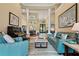 Spacious living room with tiled floors and stylish decor flowing into the dining and entrance areas at 10742 Boca Pointe Dr, Orlando, FL 32836