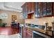 Living room includes granite bar with glass cabinets and wine fridge; features hardwood floors at 10742 Boca Pointe Dr, Orlando, FL 32836