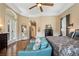 Cozy sitting area in the main bedroom with an arched doorway that leads to other rooms at 10742 Boca Pointe Dr, Orlando, FL 32836