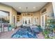 Outdoor patio with ample seating, ceiling fan, and an eye-catching blue rug at 10742 Boca Pointe Dr, Orlando, FL 32836