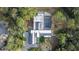 Aerial view of property surrounded by mature trees featuring a pool at 1109 Brownshire Ct, Longwood, FL 32779